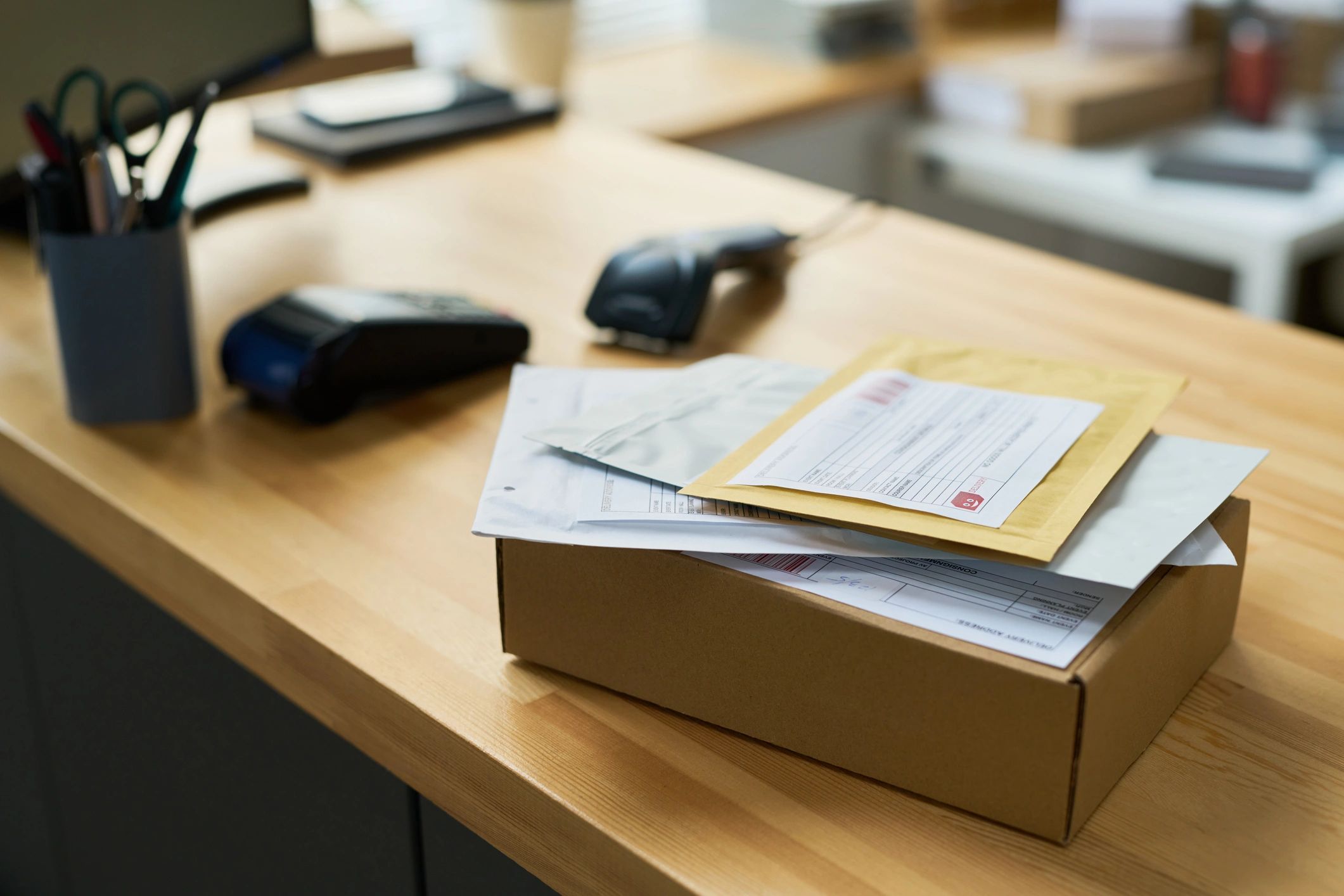 Parcels and documents on an office desk